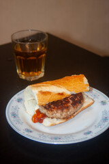 sandwich with burger ketchup and soft drink