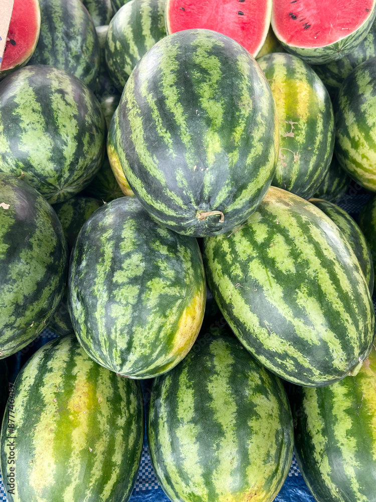 Sticker fresh ripe watermelons in market, closeup. food