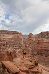 Hiker standing on top of mountain 