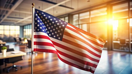 A solitary American flag waves proudly in the foreground, illuminated by warm sunlight, symbolizing patriotism and freedom, set against a blurred office background.