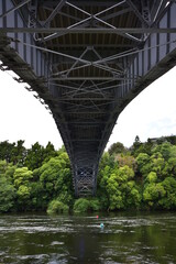 Steel river bridge arch with structure details visible from beneath. Location: Waikato New Zealand