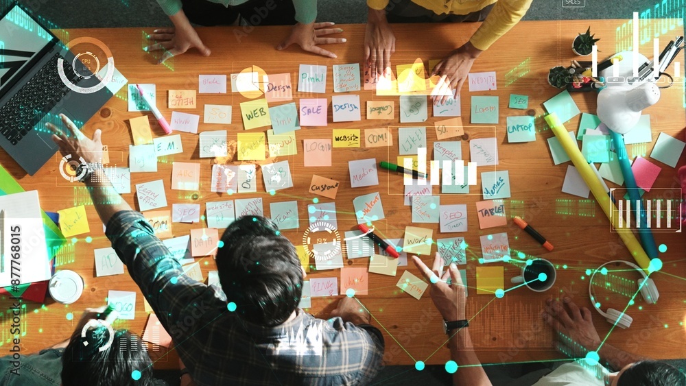 Aufkleber top down view of business team with casual outfit looking laptop screen and sharing idea. aerial vie