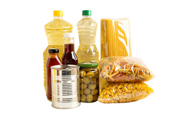 Foodstuff for donation isolated on white background with clipping path, storage and delivery. Various food, pasta, cooking oil and canned food.