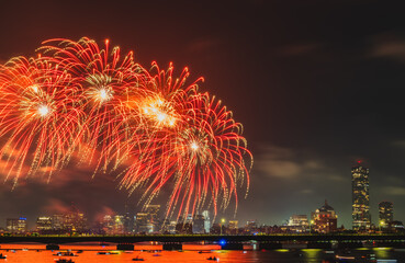 July 4th fireworks over Charles River and Boston skyline