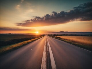 Fototapeta premium View of asphalt road with beautiful sunset in the evening