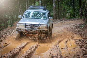 Off-road travel on muddy road. Offroad travel and driving conceptDuring the rainy season outdoor...