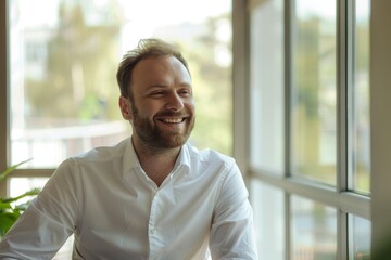 happy businessman having a break in office