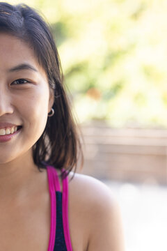 Smiling woman in casual attire enjoying outdoor time at home