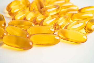 Fish oil capsules omega 3 vitamin with EPA and DHA on white background.