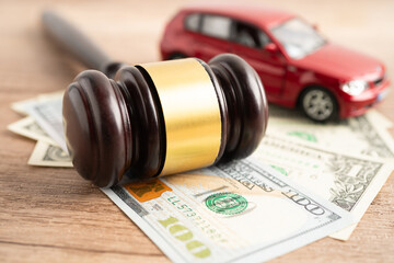 ammer gavel judge and US dollar banknote money with car vehicle accident, insurance coverage claim...