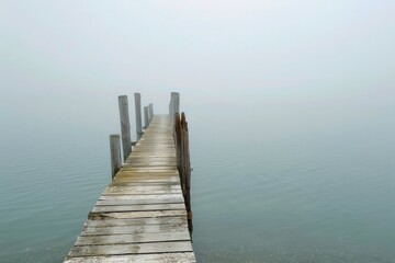 A weathered wooden pier jutting out into the misty waters of a tranquil bay, Generative AI 