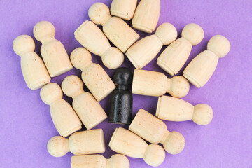 a group of peg dolls and one in black or another unique color. Hand Picked a Different and...
