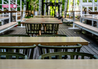 Tables and chairs on the veranda of the summer cafe.