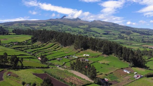 Aerial drone flight over the green province of Pichincha, Ecuador, guitig naighborhood on the slopes of the ruminahui volcan