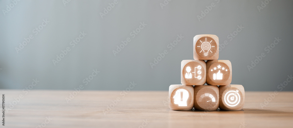 Poster wooden blocks with icons symbolizing skills, knowledge, and performance stacked in a pyramid on a wo