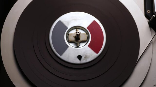 Spinning Reel to Reel Audio Tape in Professional Magnetophone, Close Up