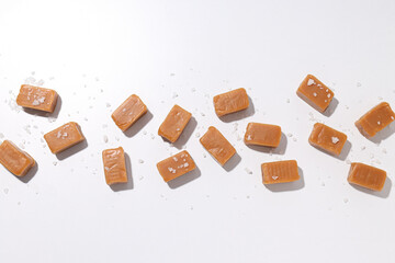 Cubes of salted caramel on a white background