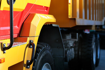 close-up side view of a tri axle dump truck