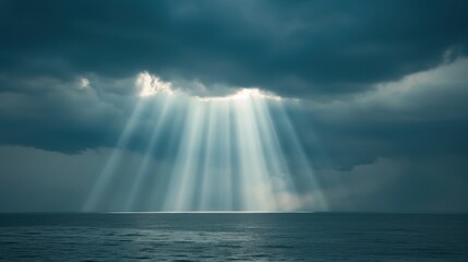 Dramatic ocean sunset with sun rays piercing through dark clouds, creating a breathtaking seascape. Perfect for nature and weather-themed projects.