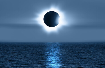 Beautiful landscape with solar eclipse over the sea at amazing sunset