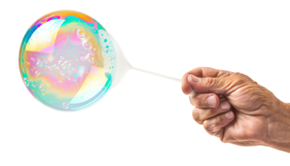 Senior hand blowing a bubble.