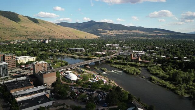 Missoula Montana aerial above Clark Fork river mountains and summer event