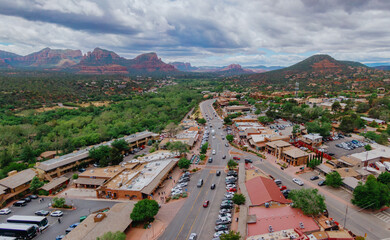 Downtown Sedona surrounded by desert mountain range, Arizona, United States of America.