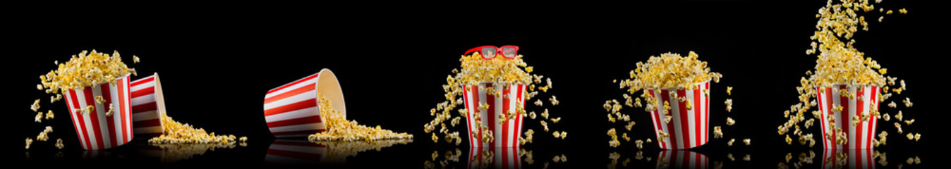 Flying popcorn from striped bucket isolated and 3d glasses on black background