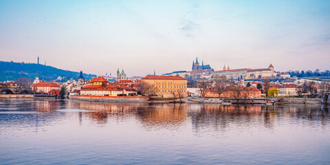 View of the city of Prague castle in hradcany and the Vltava river with Charles bridge in Prague, Czech Republic.