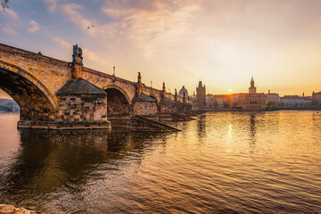 View of the city of Prague and the Vltava river with Old Town Bridge Tower on  Charles bridge  in Prague, Czech Republic.