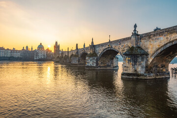 View of the city of Prague and the Vltava river with Old Town Bridge Tower on  Charles bridge  in Prague, Czech Republic.