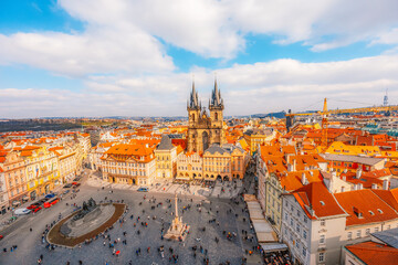 Obraz premium View of the city of Prague and old town square with buildings and Church of Our Lady before Tyn in the stare mesto from platform of Old Town Hall (Staromestska Radnice)