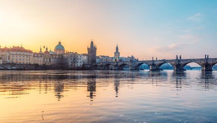 View of the city of Prague. Vltava river with Old Town Bridge Tower on  Charles bridge  in Prague, Czech Republic.