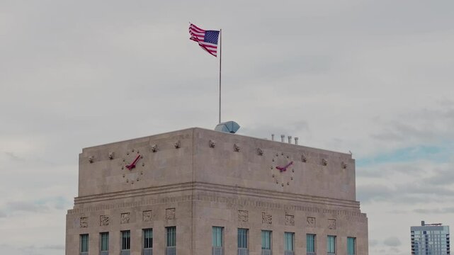 U.S. flag on top of the Houston City Hall on a cloudy day