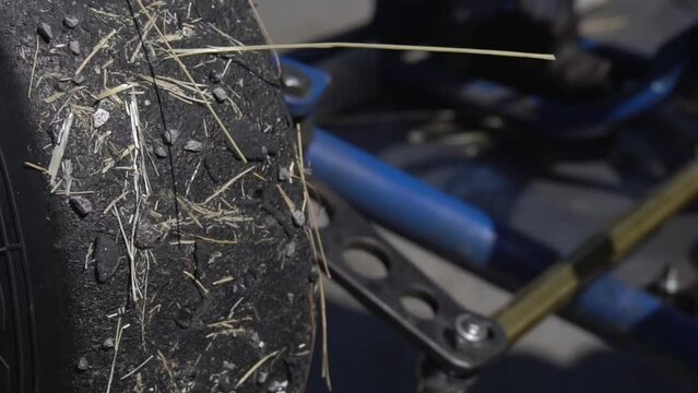Preparing a racing kart car for the race. Spinning wheel close up