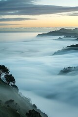 Naklejka premium Fog banks rolling in from the sea, their soft and misty formations engulfing the landscape in an eerie and ethereal embrace. Generative AI