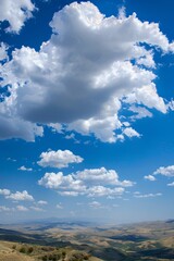 Fototapeta premium Puffy cumulus clouds floating lazily in a clear blue sky, casting whimsical shadows on the landscape below as they drift by. Generative AI