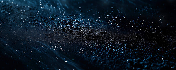 A dark blue and black abstract background with a grainy texture resembling outer space This moody and atmospheric design is perfect for creating posters wallpapers