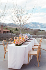 Elegant wedding table with vibrant floral arrangements