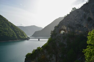 Bridge over Blue Lake with Cave in Green Mountains