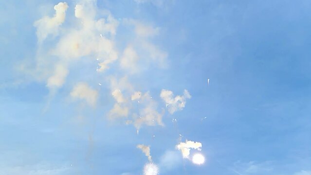 Mascleta fireworks exploding in the bright clear blue sky in the daytime in Valencia city, Spain. Backgrounds. Fallas festival