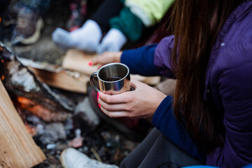 Immerse yourself in the calming presence of friends by a cozy campfire amid the serene forest. A perfect way to relax and connect with natures peaceful embrace
