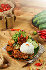 rice food and side dishes as well as fresh vegetables, and typical Indonesian chili sauce