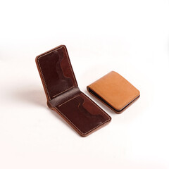 various leather wallets in various colors and cartoon cases with plain white backgrounds