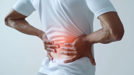 Person holding lower back in pain, highlighting discomfort and health issue. White background, isolated. Concept of injury and strain relief.