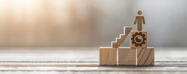 Wooden figure stands atop wooden blocks, symbolizing success and growth.