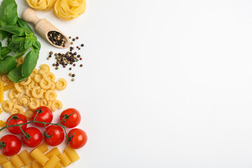 Different types of pasta, spices and products on white background, top view. Space for text
