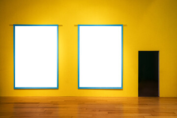 Two blank picture frame mockups on yellow wall. Opened door on the wall. Artwork templates in interior design.