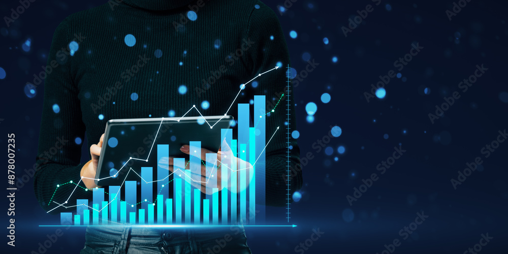 Poster close up of female hand using tablet with glowing growing business chart on blurry bokeh background.