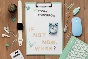 Clipboard with text IF NOT NOW WHEN?, alarm clock and stationery supplies on wooden background. Top...